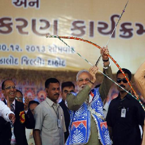 Narendra Modi holds a bow and arrow