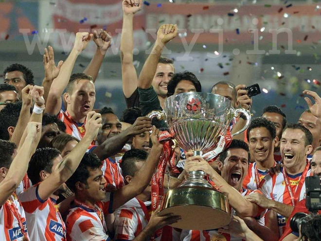 Atletico de Kolkata Players with trophy ISL winning moment of ATK